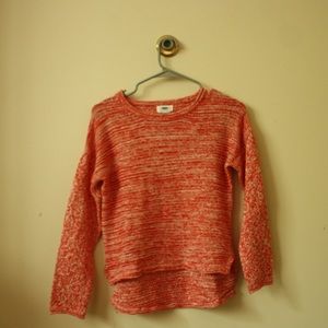 Red and white knitted sweater
